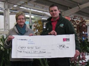 Receiving a cheque from Steve Illsley of Royston Garden Centre